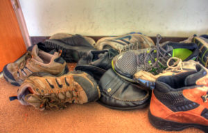 I found pictures of bigger piles, but I've got that pair of Merrells on the left there. Public domain photo via GoodFreePhotos.